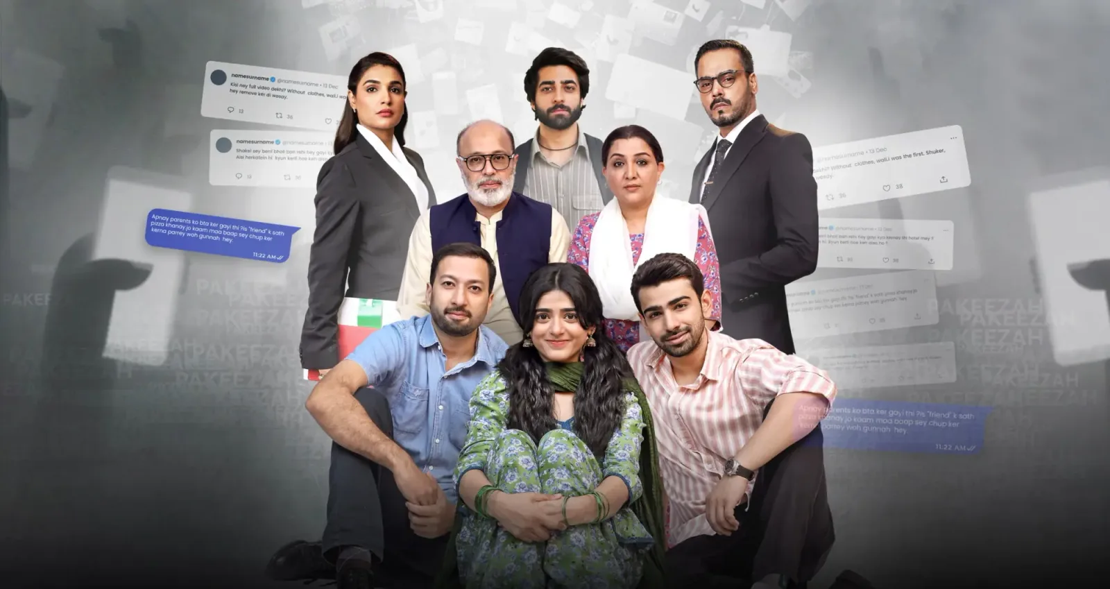 The image displays a promotional poster featuring an ensemble cast of nine individuals from a television drama series. They are arranged in two rows against a dark, textured gray background layered with semi-transparent floating social media comment overlays and smartphone graphics. In the front row, a young woman sits cross-legged in the center wearing a green patterned shalwar kameez. She is flanked by two young men sitting on the floor beside her—one on her right in a blue button-down shirt and another on her left in a pink striped shirt. The second row consists of six standing characters: an older man with glasses and a vest, a middle-aged woman in a patterned shawl, a young man with a beard, a woman in a formal white shirt and black blazer, and a man in a sharp black suit with a tie. The cast members exhibit serious, concerned, or intense facial expressions, suggesting a high-stakes dramatic narrative involving public scrutiny or online controversy.