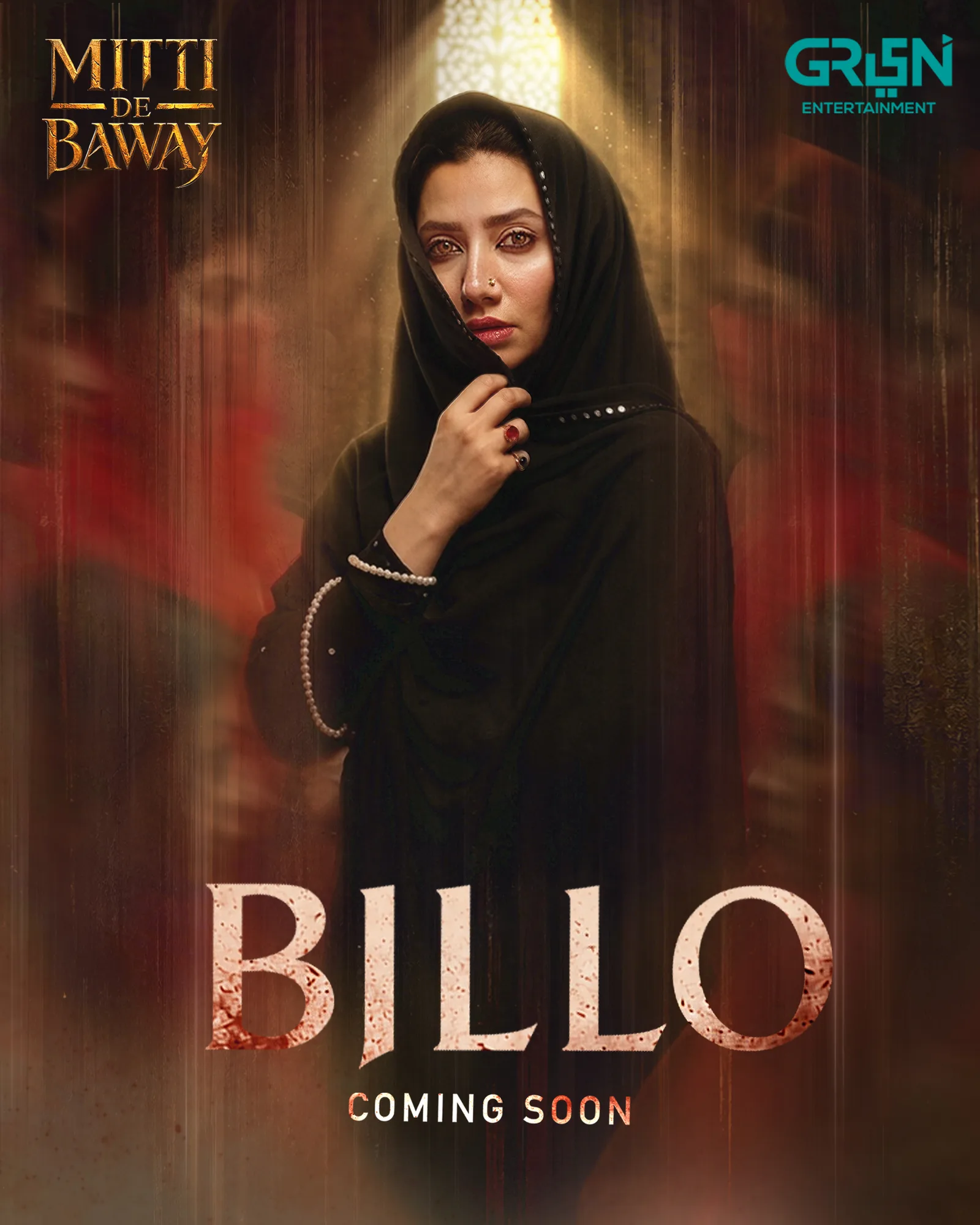 A dark, atmospheric promotional poster for the Pakistani television drama serial Mitti De Baway. The center of the poster features a medium shot of renowned Pakistani actress Mahira Khan, who portrays the intense character "Billo". She is draped in a solid black hijab (headscarf) and abaya, subtly embellished with small, reflective black beads along the edge of the scarf. Her left hand is raised to her face, delicately pulling a section of the black fabric across her chin and mouth, exposing only her expressive, sorrowful eyes and nose, which is adorned with a traditional ring. A shimmering pearl bracelet encircles her wrist, and a large red gemstone ring is visible on her finger. The background is cast in a moody, textured brown and golden twilight hue with a soft, warm light shining from above her head, casting gentle highlights on her scarf. Faintly silhouetted figures blur into the dark background behind her. At the top left corner, the title of the show is written in a stylized, metallic gold serif font that reads "MITTI DE BAWAY". In the top right corner, the bright cyan and white logo of "GREEN ENTERTAINMENT" is visible. Spanning across the lower third of the image is the character name "BILLO" in a bold, weathered white font with distressed textures, suggesting grit and drama. Directly beneath her name, the words "COMING SOON" are printed in a clean, smaller sans-serif white font.