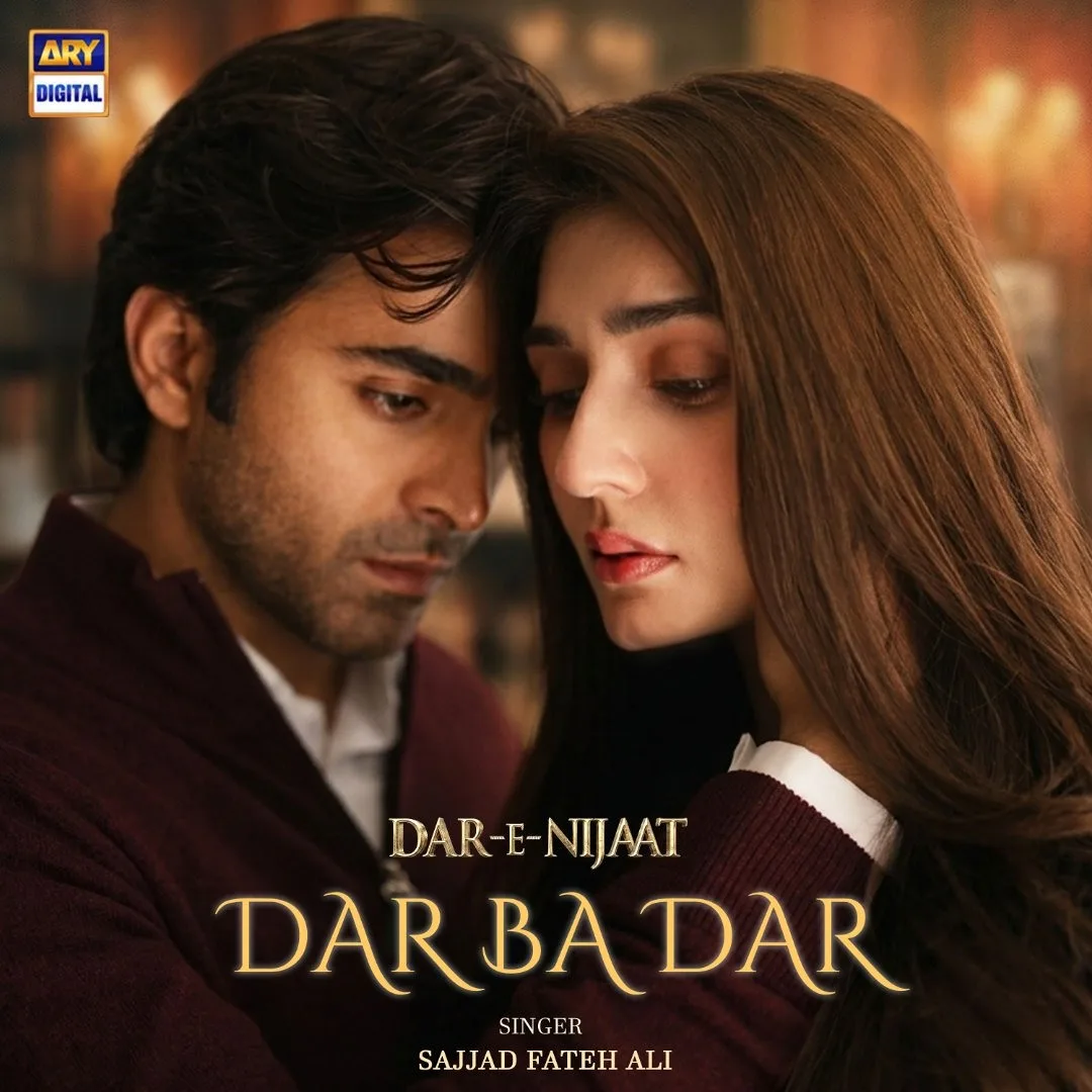 A dramatic promotional poster features actor Sheheryar Munawar Siddiqui on the left, wearing a deep maroon jacket over a white collared shirt, leaning close to actress Dur-e-Fishan Saleem on the right. She has long, straight brown hair, a soft makeup look, and appears deep in thought with a solemn expression. The warm, dimly lit background creates an intimate, emotional atmosphere. Elegant text overlays across the bottom read "DAR-E-NIJAAT" followed by "DAR BA DAR" in a larger, stylized gold font, and credits "SINGER: SAJJAD FATEH ALI" at the very bottom. An ARY Digital logo is visible in the top left corner.