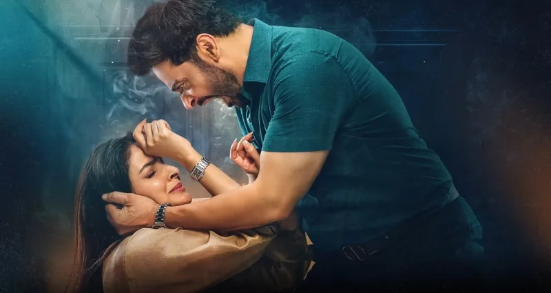 A horizontal banner promotional poster for the Pakistani television drama series Case No. 9. The scene is dramatically lit and shrouded in an atmospheric, hazy blue smoke. On the left side of the frame, a Pakistani woman with long dark hair, played by actress Saba Qamar, is lying flat on her back. She looks up with an expression of intense vulnerability and fear, her hands raised slightly to protect her face. On the right, a Pakistani man with dark hair, a beard, and a mustache, played by actor Faysal Quraishi, leans forcefully over her. He wears a teal button-up shirt with rolled-up sleeves and dark trousers with a belt. His mouth is wide open in an aggressive, furious shout, and his hands firmly grasp her face and neck area, creating a highly tense, high-conflict confrontation.
