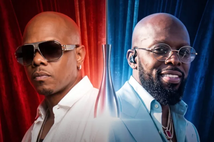 An intense promotional image captures American R&B singer-songwriters Donell Jones and Joe (Joseph Lewis Thomas) posing side-by-side against a split backdrop of draped curtains, with Donell Jones on the left wearing modern shield sunglasses and a white collared shirt against red curtains, and Joe on the right sporting round wire-rimmed glasses, a groomed beard, and a light blue suit jacket against blue curtains, while a stylized silver trophy or microphone stand sits illuminated in the center between them to signify an upcoming musical event or Verzuz battle.