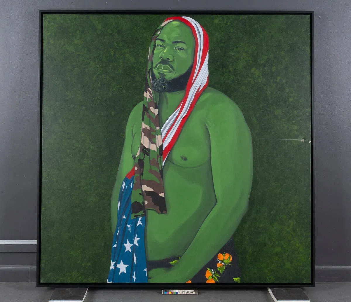 The damaged painting, &ldquo;Man in the Garden&rdquo; by the artist Clarence Heyward, was part of an exhibition called &ldquo;Eden.&rdquo;Credit...Houston Museum of African American Culture