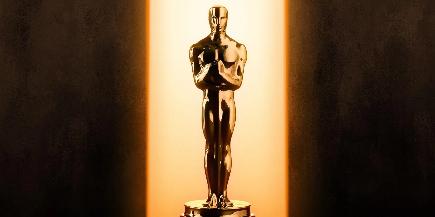 The gold Oscar statuette, officially named the Academy Award of Merit, is a globally recognized symbol of filmmaking excellence designed by MGM art director Cedric Gibbons in 1928. Each standard trophy stands 13.5 inches tall and weighs a solid 8.5 pounds. It depicts a stylized knight holding a crusader's sword while standing atop a five-spoke film reel, which represents the original branches of the Academy of Motion Picture Arts and Sciences: actors, directors, producers, technicians, and writers. Manufactured using advanced electroplating technology by Epner Technology in Brooklyn, New York, the core is cast in solid bronze and layered sequentially with copper, nickel, and silver before receiving its final, brilliant finish of 24-karat gold. This flawless gold coating is highly specialized, utilizing the exact same processing standards that NASA applies to its aerospace instruments.