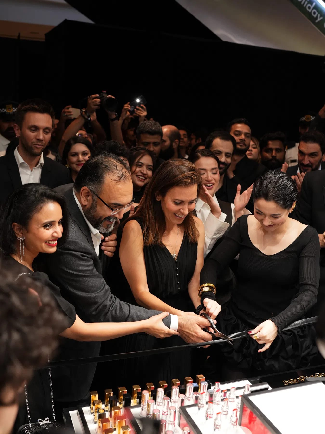 YSL Beauty has officially launched in Pakistan with a grand debut from July 8 to July 15, 2026, introducing its first-ever flagship boutique on the Ground Floor of Dolmen Mall DHA in Lahore through its local retail partner, Yellow Corporation Private Limited. Celebrating the arrival with a dynamic "YSL Beauty Light Club" campaign, the ultra-modern, Parisian-inspired retail space features a full lineup of luxury fragrances, high-end makeup, and premium skincare. The star-studded opening ceremony was headlined by renowned actress Hania Aamir, who embodied classic Parisian style in an all-black ensemble alongside top influencers, models, and socialites. To elevate the launch experience, the event showcases a vibrant "Berry Crush" popsicle cart, customized live perfume engraving stations, and the exclusive regional debut of the brand's highly anticipated fragrance, YSL Libre Berry.