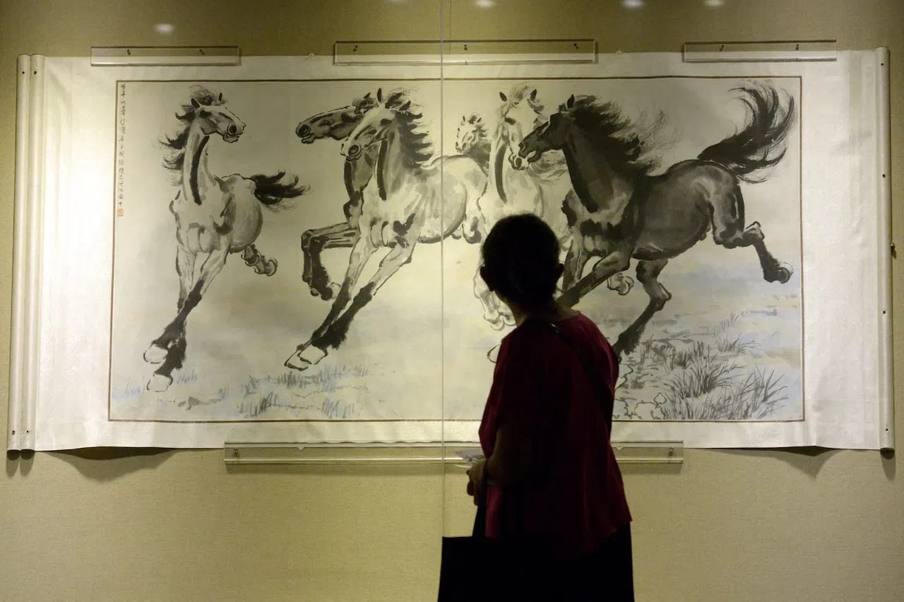 "Six Galloping Horses," painted in 1942, is one of the most iconic ink-wash masterpieces by the late Chinese master Xu Beihong. Seamlessly merging traditional Chinese brushwork with Western techniques of perspective and anatomy, the painting is permanently housed at the Xu Beihong Memorial Museum in Beijing.Historical Significance:Patriotic Symbolism: Created during World War II, Xu's horses were meant to embody unyielding boldness, resilience, and the untamed spirit of the Chinese people during the War of Resistance Against Japanese Aggression.Brushwork & Style: The piece captures horses in full flight utilizing strong, simple, and vigorous brush strokes with minimal outlines to depict nuanced postures and vivid expressions.Where to Experience His Art in Beijing:Xu Beihong Memorial Museum (located in Beijing): The primary institution dedicated to his life and works. The museum occasionally rotates its collection and offers commemorative merchandise and displays of his personal calligraphy and seals.Special Exhibitions: Curated exhibits featuring this masterpiece and other works are intermittently hosted at notable local galleries and cultural venues across the city, such as recent displays at the Financial Street Shopping Center.