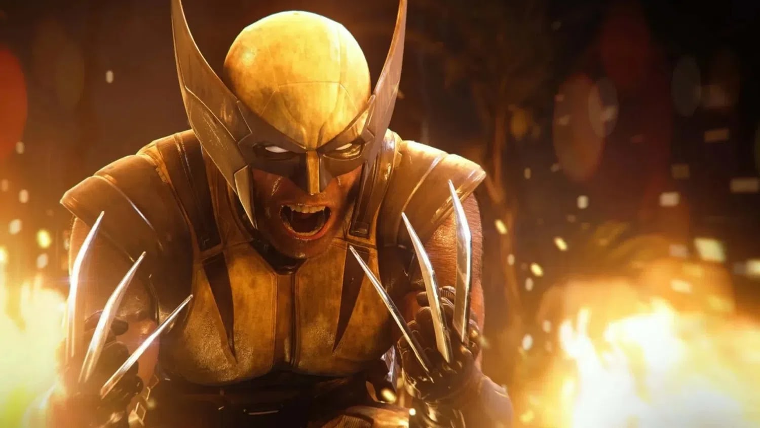 A cinematic, close-up shot of the superhero Wolverine from the video game Marvel's Wolverine. He wears his iconic yellow and brown suit along with a matching pointed cowl mask that reveals only his aggressive, roaring mouth and glowing white eyes. He is crouched down in a battle-ready stance against a chaotic background filled with bright, fiery explosions and floating sparks. His metallic claws are fully extended from both of his gloved hands, reflecting the intense orange light of the surrounding fire.