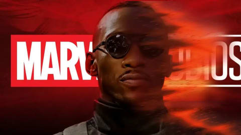 A dramatic concept poster for Marvel Studios featuring actor Mahershala Ali as Blade. He is positioned in the center, facing forward while wearing his signature dark sunglasses and a black tactical turtleneck. The background is a deep, textured red, overlaid with a large, white Marvel Studios logo. The right side of his face and body dynamically dissolves into a trail of fiery embers, black ash, and motion blur, conveying a sense of supernatural energy or disintegration. An actor portraying the Marvel character Blade with a stylized, fiery disintegration effect.
