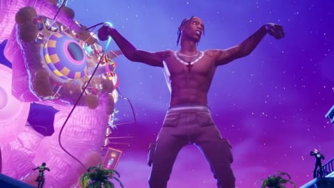 An oversized virtual avatar of hip-hop artist Travis Scott dominates a vibrant, neon-purple night sky as he performs during his groundbreaking "Astronomical" concert event within Epic Games' battle royale game, Fortnite. The shirtless character model towers over the game's colorful landscape, arms outstretched in a performance pose against a backdrop filled with floating, multi-colored amusement park structures and distant glowing stars, while smaller player characters look on from rooftops and platforms below during the highly successful April 2020 live music activation.