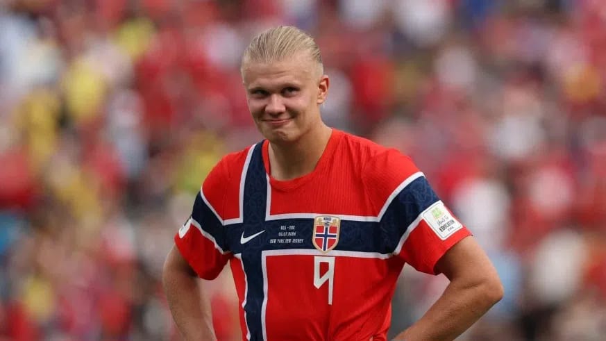 Erling Haaland (playing under his full maternal name "Braut Haaland" for the national team) is a 25-year-old Norwegian professional footballer who plays as a striker for English Premier League club Manchester City and the Norway national team. Widely regarded as one of the best and most prolific goalscorers in the world, he is celebrated for his immense strength, blistering speed, and clinical finishing inside the box.At the 2026 FIFA World Cup, Haaland is playing the role of Norway's talismanic star striker and primary offensive focal point, single-handedly driving his country into uncharted territory.Performance & Impact in the 2026 World CupAfter dragging Norway to their first World Cup qualification in 28 years by scoring 16 goals in the qualifiers, Haaland has taken the tournament in North America by storm.Leading the Golden Boot Race: As of the Round of 16, Haaland has scored 7 goals in just 4 matches, tying him with Lionel Messi and Kylian Mbappé at the top of the tournament’s scoring charts.Historical Knockout Heroics: On July 5, 2026, Haaland scored a stunning second-half brace to defeat 5-time champions Brazil 2-1. This monumental win sent Norway into the World Cup Quarter-finals for the first time in their history.Unprecedented Efficiency: Haaland is averaging a goal every 14 touches this tournament—the highest efficiency rating of any World Cup striker in the last 60 years. He also broke the record for the most goals scored by a player in their debut World Cup tournament since 1974.