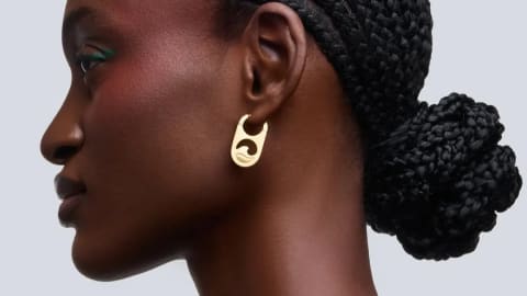 Adekunle Gold's 'WAVE' earrings are the debut signature fashion pieces from his newly launched lifestyle and accessory brand, Tuffman. Known for making bold earring choices a core part of his fashion identity, the Nigerian Afrobeats star transitioned from "music people can hear" to "something they can wear" with this limited-edition jewelry drop.