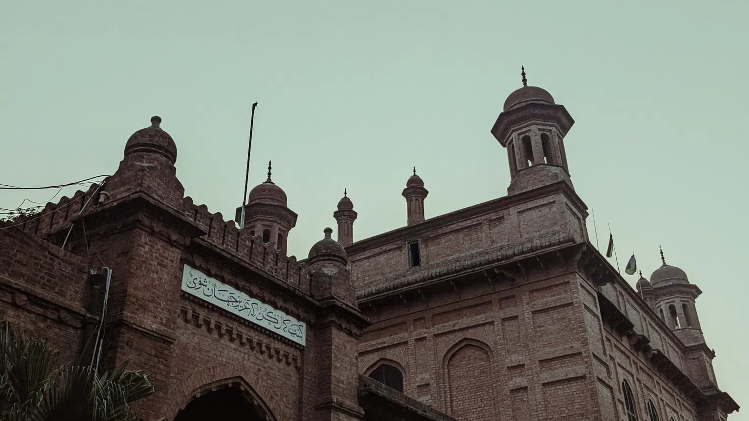 The National College of Arts (NCA) Lahore stands as Pakistan's premier, federally chartered public art university and the second-oldest art institution in South Asia. Founded in 1875 as the Mayo School of Industrial Arts to safeguard and document regional craftsmanship under the British Raj, the institution's pedagogical roots were deeply influenced by the global Arts and Crafts Movement. Its inaugural principal, British artist and curator John Lockwood Kipling, established a curriculum that uniquely fused traditional Punjabi and Mughal craft techniques with European perspective-drawing methods. This design-and-craft ethos crystallized architecturally in the college's historic campus on Mall Road. Designed by the pioneering master builder Bhai Ram Singh and constructed by the legendary engineer Sir Ganga Ram, the iconic campus features red-brick, Indo-Saracenic facades, protective verandas, structural arches, and ornamental chatris. The historic Kipling Block, whose foundation stone was laid in 1880, serves as a physical anchor directly adjacent to the Lahore Museum, which was originally curated alongside the school to provide students with raw reference material.Following Pakistan's independence, the facility underwent a radical modernization in 1958 under the guidance of its first Pakistani principal, Mian Barkat Ali. Restructured into the National College of Arts, the university successfully decolonized its curriculum by importing global design methodologies and integrating experimental, non-conformist practices. Today, the institution organizes its academic scaffolding across the faculties of Art, Design, Architecture, Film & Television, and Performing Arts. It accommodates diverse specializations ranging from traditional Miniature Painting and Ceramic Design to contemporary Musicology and Visual Communication Design. Entrance is exceptionally competitive, drawing talent nationwide via a strict, multi-tiered provincial quota system, written testing, and rigorous live drawing examinations. This immersive, studio-centric cultural melting pot has birthed generations of visionary changemakers. Its alumni include modern art pioneers like Zahoor ul Akhlaq and Salima Hashmi, alongside prominent contemporary cultural icons like Ali Zafar and Ayesha Omar. Expanding its national reach, NCA also hosts specialized satellite campuses—including its Rawalpindi Campus and the newly inaugurated Gilgit-Baltistan Campus—solidifying its role as a monumental pillar of artistic scholarship, creative freedom, and cultural preservation across the region.