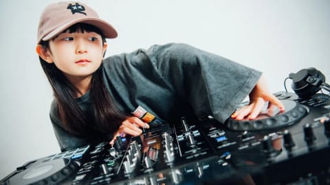 DJ Rinoka, a nine-year-old Japanese prodigy, has gained global recognition for her high-energy techno sets and skill, having been named the world's youngest female club and music festival DJ at age six. Teaching herself on a mixing console, she balances a professional performance career with normal childhood activities.