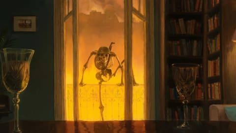 This image is a frame from the apocalyptic animated short film Danse Macabre (2026), directed by Dutch filmmaker and painter Hisko Hulsing. Set to the second movement of Dmitri Shostakovich's Symphony No. 10, the film uses over 75 hand-painted oil canvases combined with 2D and CG animation to create a nightmarish, hand-crafted aesthetic. The scene depicts a skeletal soldier wearing a helmet peering through a library window into a room with crystal goblets, against a backdrop of a city engulfed in orange flames.