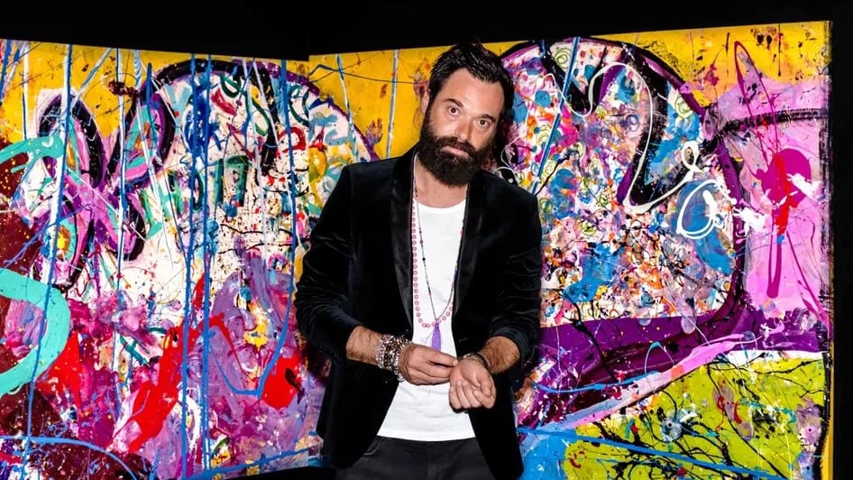 Sacha Jafri, a prominent British contemporary artist, stands confidently in front of a vibrant, multicolored abstract section of his record-breaking masterpiece, titled The Journey of Humanity. Officially certified by the Guinness World Records as the largest art canvas in the world, the monumental artwork spans an astonishing 17,000 square feet. Jafri meticulously created this multi-paneled initiative over several months while in lockdown at Dubai's Atlantis, The Palm. He combined thousands of gallons of paint, intricate layers of splatters, and poignant artwork contributions submitted by children from over 140 countries. Although the vast scale of the canvas was originally planned to be divided into 70 distinct segments for separate auctions, the entire painting was purchased as a whole by a single bidder for a historic $62 million at a charity auction. This extraordinary sale catapulted Jafri into the ranks of the most expensive living artists while simultaneously raising substantial funding to support global health, education, and digital connectivity initiatives for children in underserved communities through partnering organizations like Dubai Cares, UNICEF, and UNESCO.