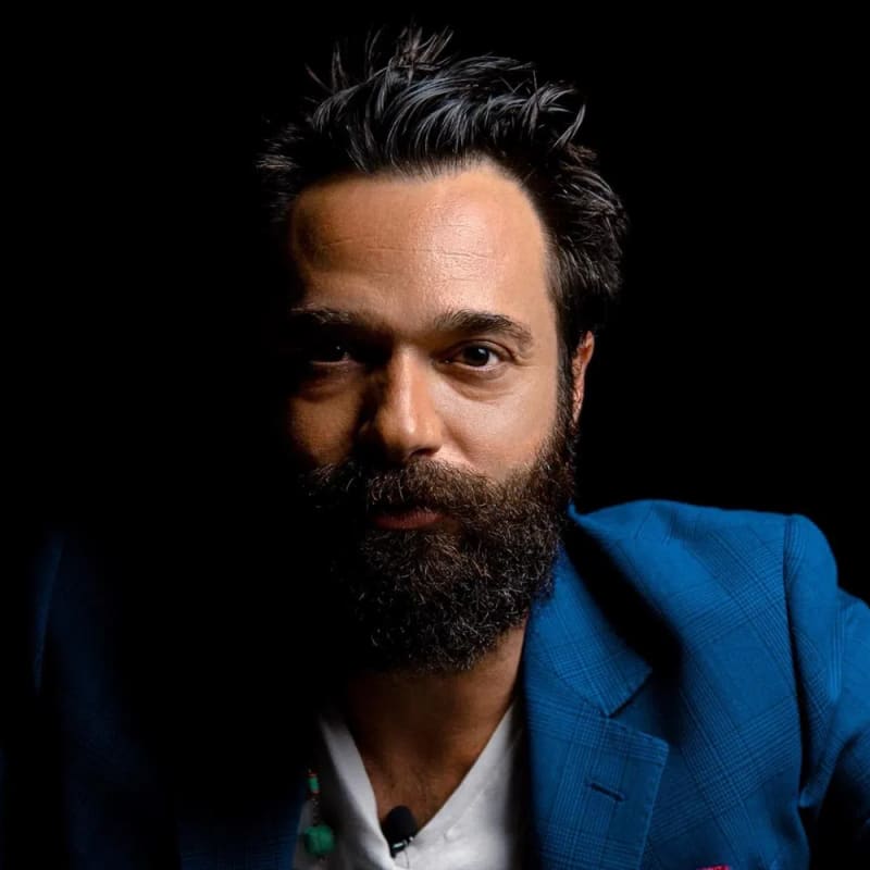 Sacha Jafri is a contemporary British visual artist celebrated for his large-scale, high-energy paintings that blend abstract styles with raw human emotion, a process he creates during intensely focused, meditative states he calls "magical realism". Born in London in 1977 to a prominent diplomatic family with Indian-Pakistani, French, and Iranian roots, he attended Eton College with Prince William and earned his Master of Fine Arts from Oxford University before rising to global fame for his record-breaking charitable projects. He achieved international acclaim—and a Guinness World Record—for creating "The Journey of Humanity," a 17,000-square-foot canvas painted in isolation over seven months at Dubai's Atlantis, The Palm, which sold at auction in 2021 for a historic $62 million to benefit children's charities like UNICEF and UNESCO. A fierce advocate for human empathy who strictly rejects digital and AI-generated art, Jafri tightly controls his exclusive art market by turning down 99% of prospective buyers, yet his physical masterpieces are heavily collected by high-profile figures including Barack Obama, Bill Gates, and Leonardo DiCaprio, while his creative ambitions have expanded into high-end collaborations, such as custom-designed Rolls-Royce Phantoms, and historic space initiatives, like sending his artwork onto the surface of the moon.