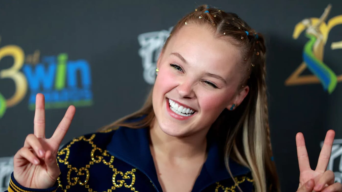 JoJo Siwa (born May 19, 2003) is an American singer, dancer, actress, and famous media personality who originally gained public attention as a competitor on the reality television series Dance Moms. Following her reality TV success, she partnered with Nickelodeon to build a massive global brand centered around her signature "JoJo Bows," colorful merchandise, and energetic pop music targeted at young children. In recent years, Siwa has undergone a highly publicized creative evolution, shifting away from her kid-friendly image toward a mature, edgy adult pop persona highlighted by her 2024 viral single "Karma" and her EP Guilty Pleasure. Beyond her music career, she has made reality television history as part of the first same-sex pairing on Dancing with the Stars, served as a judge on So You Think You Can Dance, and appeared on Celebrity Big Brother UK. A prominent figure in the LGBTQ+ community since coming out in 2021, Siwa currently identifies as queer and is frequently covered by entertainment media for her unfiltered public commentary, distinct fashion choices, and high-profile romantic relationships.