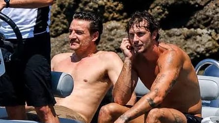 Actor Pedro Pascal was photographed shirtless alongside male model Christian Hogue aboard a luxury tender boat during a high-profile vacation. The relaxed outing took place in late July 2026 off the scenic coast of Mallorca, Spain, where the Hollywood star joined a star-studded group of close celebrity friends, including actor Jason Bateman and director Judd Apatow, to soak up the Mediterranean summer sun. 