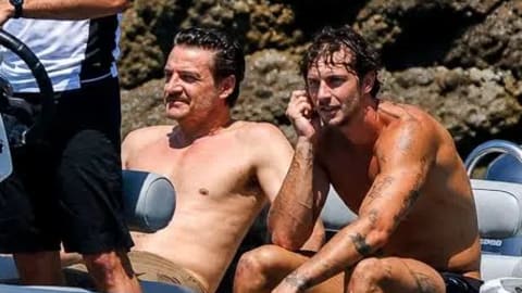 Actor Pedro Pascal was photographed shirtless alongside male model Christian Hogue aboard a luxury tender boat during a high-profile vacation. The relaxed outing took place in late July 2026 off the scenic coast of Mallorca, Spain, where the Hollywood star joined a star-studded group of close celebrity friends, including actor Jason Bateman and director Judd Apatow, to soak up the Mediterranean summer sun. 