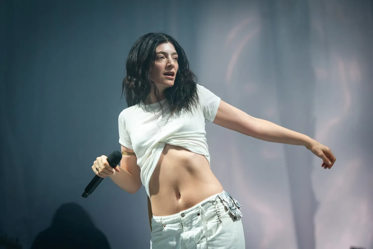 Early Life and Breakthrough (Pure Heroine) Born Ella Marija Lani Yelich-O'Connor in Auckland, New Zealand, Lorde was signed to Universal Music Group at just 12 years old after performing at a school talent show. She adopted her stage name out of a fascination with royalty and aristocracy, adding an "e" to make it feel more feminine. In 2013, at age 16, she released her debut single "Royals," which became an international phenomenon. The song reached number one on the Billboard Hot 100, making her the youngest solo artist to achieve a US number-one single since 1987. Her debut album, Pure Heroine (2013), won critical acclaim for its minimalist production and smart, cynical critique of mainstream pop culture and suburban teenage life.Artistry and Maturity (Melodrama)In 2017, Lorde returned with her highly anticipated sophomore album, Melodrama. Moving away from the detached, cool perspective of her debut, Melodrama was a deeply emotional concept album that explored the psychological highs and lows of a single house party following a difficult breakup. Co-produced with Jack Antonoff, the album was a masterclass in modern alt-pop, featuring grander orchestration, dance-pop beats, and intensely vulnerable songwriting. It was universally praised by critics, debuted at number one on the Billboard 200, and earned a Grammy nomination for Album of the Year, cementing her reputation as one of the definitive songwriters of her generation.Sonic Evolution and Independence (Solar Power to Virgin)Lorde's subsequent eras marked a radical shift in both her musical direction and career structure. Her third album, Solar Power (2021), was a sunny, acoustic-folk departure inspired by 1970s psych-rock and her relationship with the natural world of New Zealand. In 2025, she returned to a darker, electronic soundscape with her fourth studio album, Virgin. The record explored modern womanhood and city life through heavy basslines and club-ready tracks like "What Was That" and "Hammer." Following this release, Lorde chose not to renew her long-term major label contract, officially operating as a fully independent artist and launching a massive global festival run to showcase her new independent era.