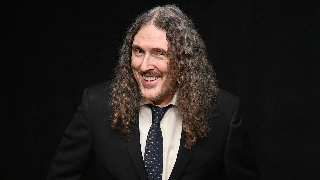 Alfred Matthew "Weird Al" Yankovic is an American musician, satirist, and five-time Grammy Award winner who stands as the most successful comedy recording artist of all time. Born in 1959, he rose to fame in the early 1980s by weaponizing his sharp wit and accordion skills to create meticulously produced pop music parodies that frequently rivaled the popularity of the original tracks. Over a career spanning more than four decades, Yankovic has achieved rare longevity in the music industry, joining an elite group of artists like Michael Jackson and Madonna who have scored Top 40 singles across four consecutive decades. His mastery of the medium culminated in 2014 with his album Mandatory Fun, which made history as the first comedy album ever to debut at number one on the Billboard 200 chart. Beyond his studio recordings, Yankovic is a multi-talented entertainer who wrote and starred in the 1989 cult classic film UHF, co-wrote the Emmy-winning 2022 satirical biopic Weird: The Al Yankovic Story, and continues to command massive audiences worldwide through high-energy live concert tours.