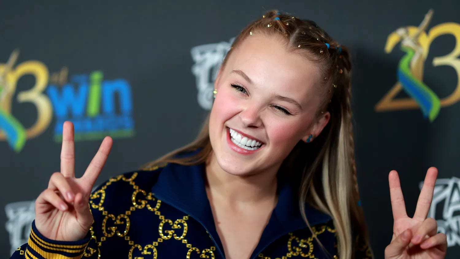JoJo Siwa (born May 19, 2003) is an American singer, dancer, actress, and famous media personality who originally gained public attention as a competitor on the reality television series Dance Moms. Following her reality TV success, she partnered with Nickelodeon to build a massive global brand centered around her signature "JoJo Bows," colorful merchandise, and energetic pop music targeted at young children. In recent years, Siwa has undergone a highly publicized creative evolution, shifting away from her kid-friendly image toward a mature, edgy adult pop persona highlighted by her 2024 viral single "Karma" and her EP Guilty Pleasure. Beyond her music career, she has made reality television history as part of the first same-sex pairing on Dancing with the Stars, served as a judge on So You Think You Can Dance, and appeared on Celebrity Big Brother UK. A prominent figure in the LGBTQ+ community since coming out in 2021, Siwa currently identifies as queer and is frequently covered by entertainment media for her unfiltered public commentary, distinct fashion choices, and high-profile romantic relationships.